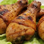 Best Damn Air Fryer Chicken Legs Homemade Recipe 12 Close-up view of perfectly cooked Best Damn Air Fryer Chicken Legs with seasoning